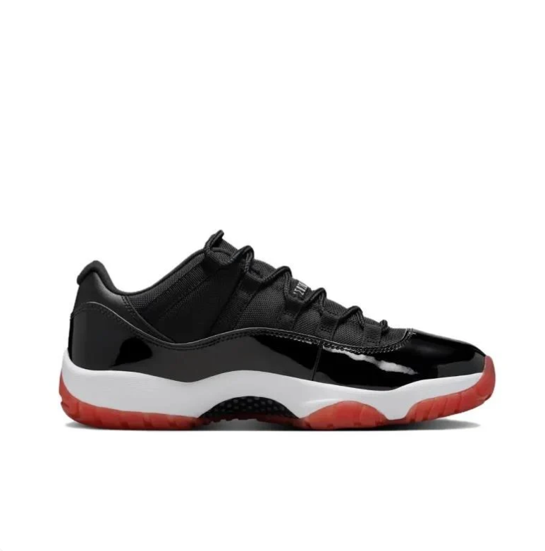Air Jordan 11 Low Black Sneakers with White Midsole & Red Outsole