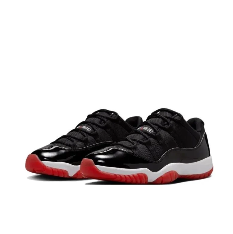 Air Jordan 11 Low Black Sneakers with White Midsole & Red Outsole